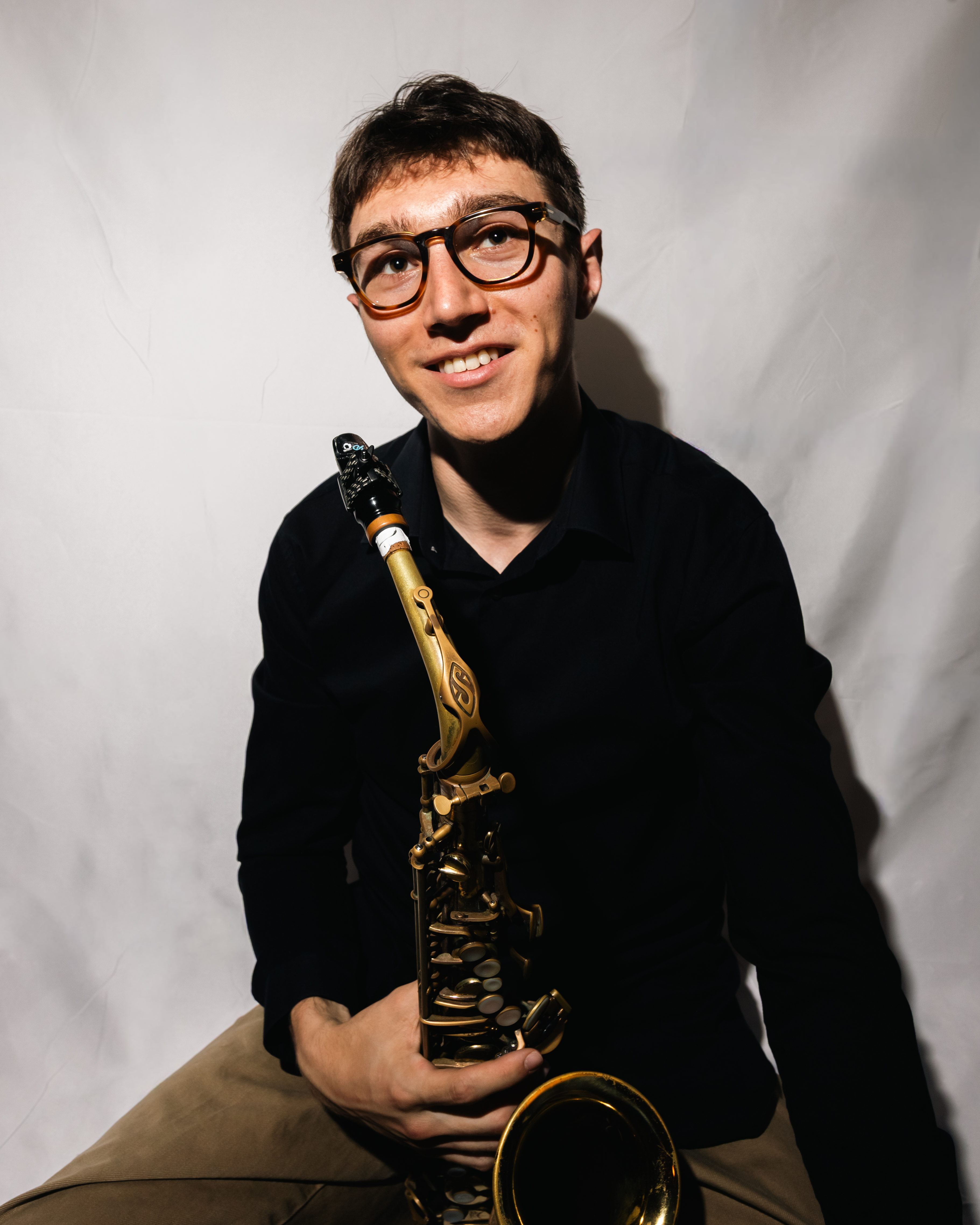 Cameron Sewell-Snyder holding a saxophone